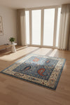 Decorative rug with paisley patterns in blue, red, and beige on a white background